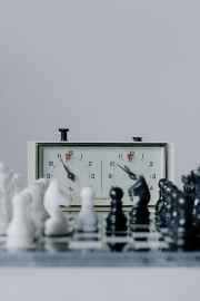 white and black chess pieces on a chess board
